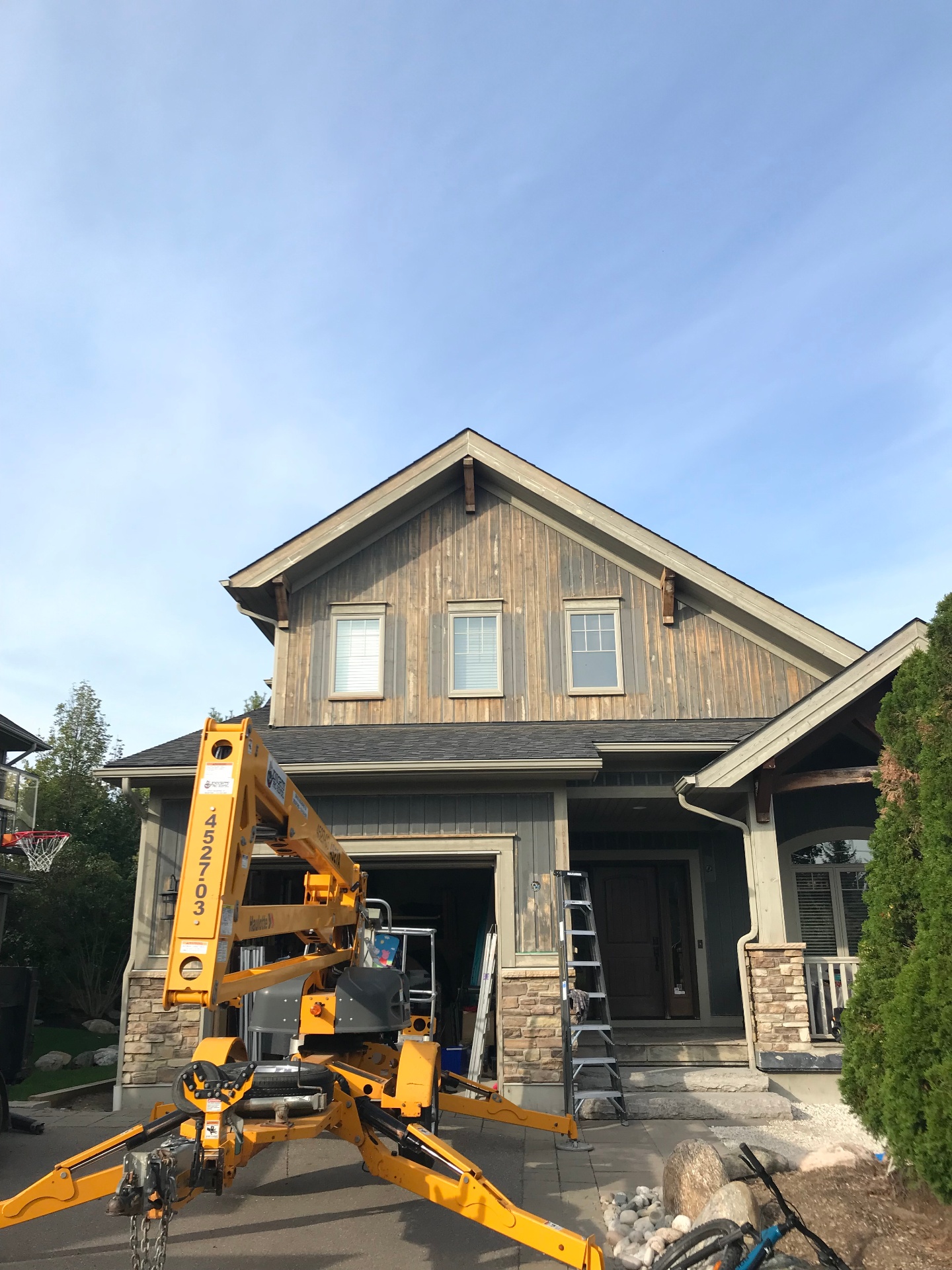 Residential home exterior before painting - weathered wood siding in Collingwood