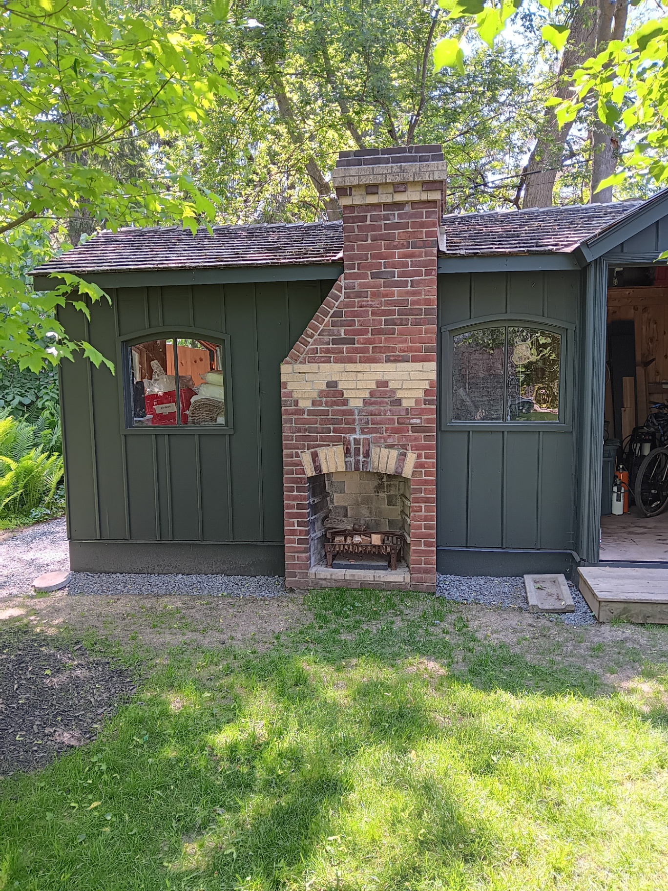 Shed exterior after painting - fresh sage green finish