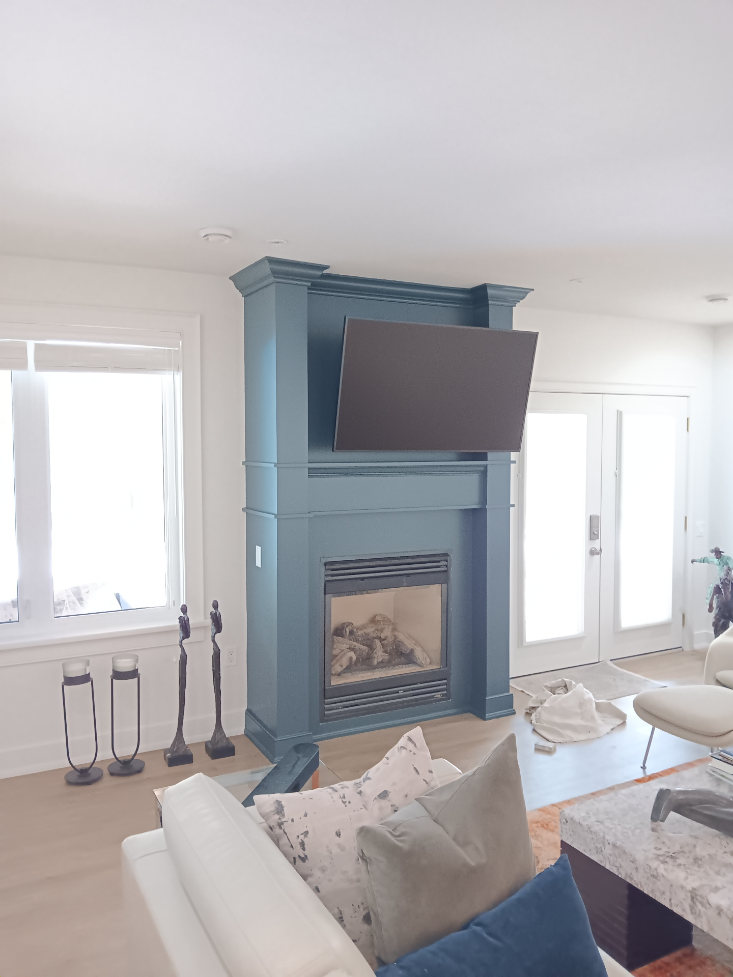 Beautifully finished blue painted fireplace feature wall with architectural details