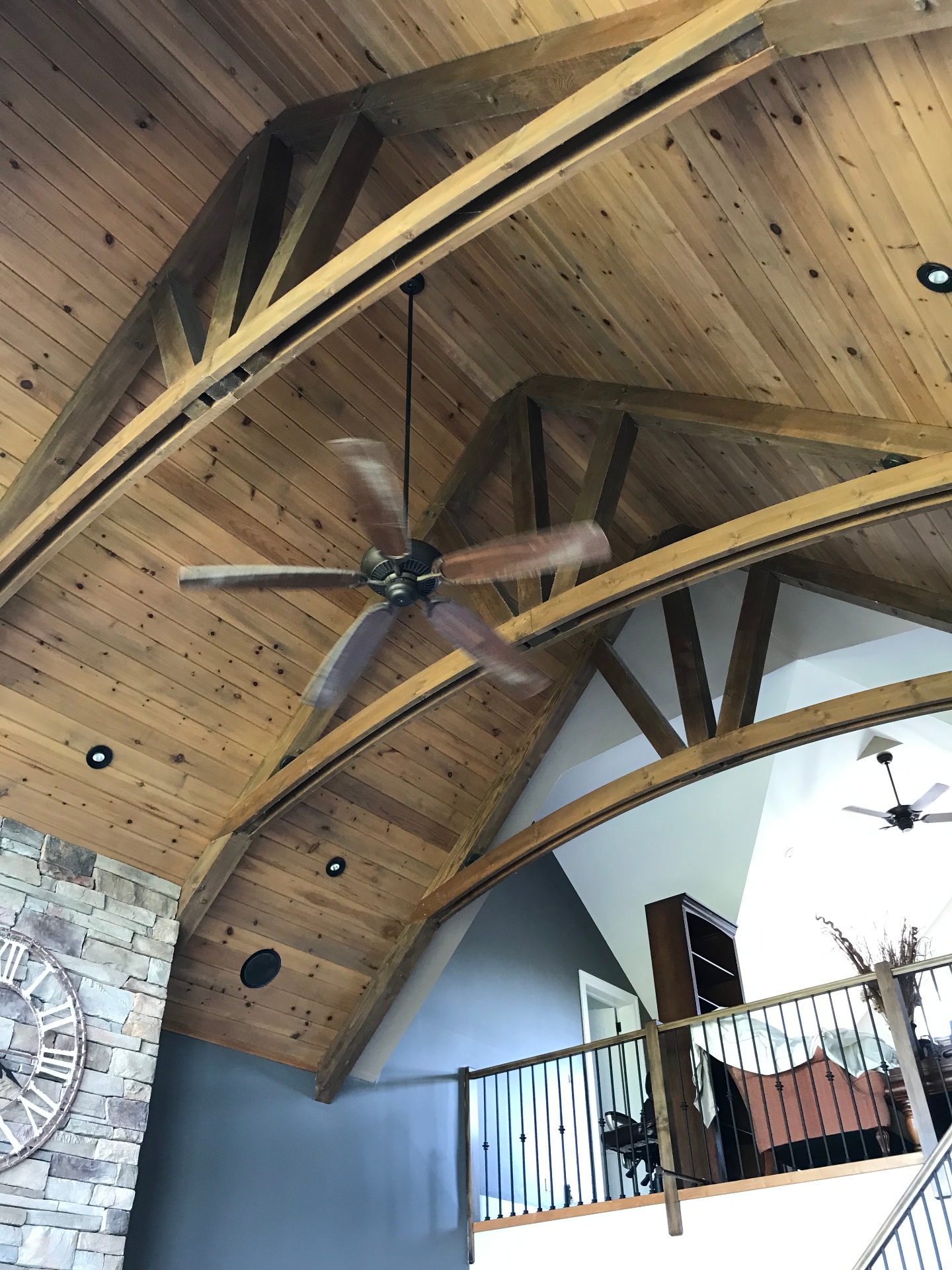 Before interior painting: natural wood vaulted ceiling with exposed beams